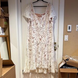 Anthropologie Cream Lace Dress with short sleeves.